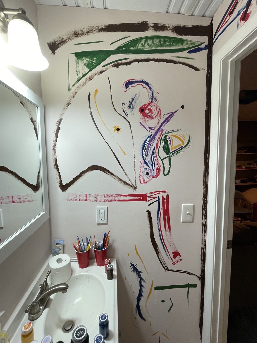 Mural - A room or bathroom wall is photographed with large loose painted lines and objects visible in the room, documenting…